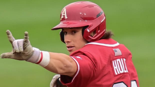 Arkansas Razorbacks Peyton Holt celebrates a second-inning homer against Louisiana Tech